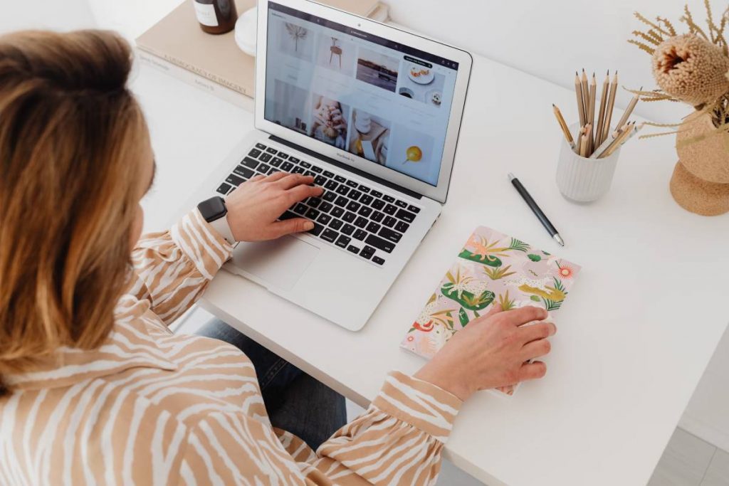 A woman working on a plastic-free office desk